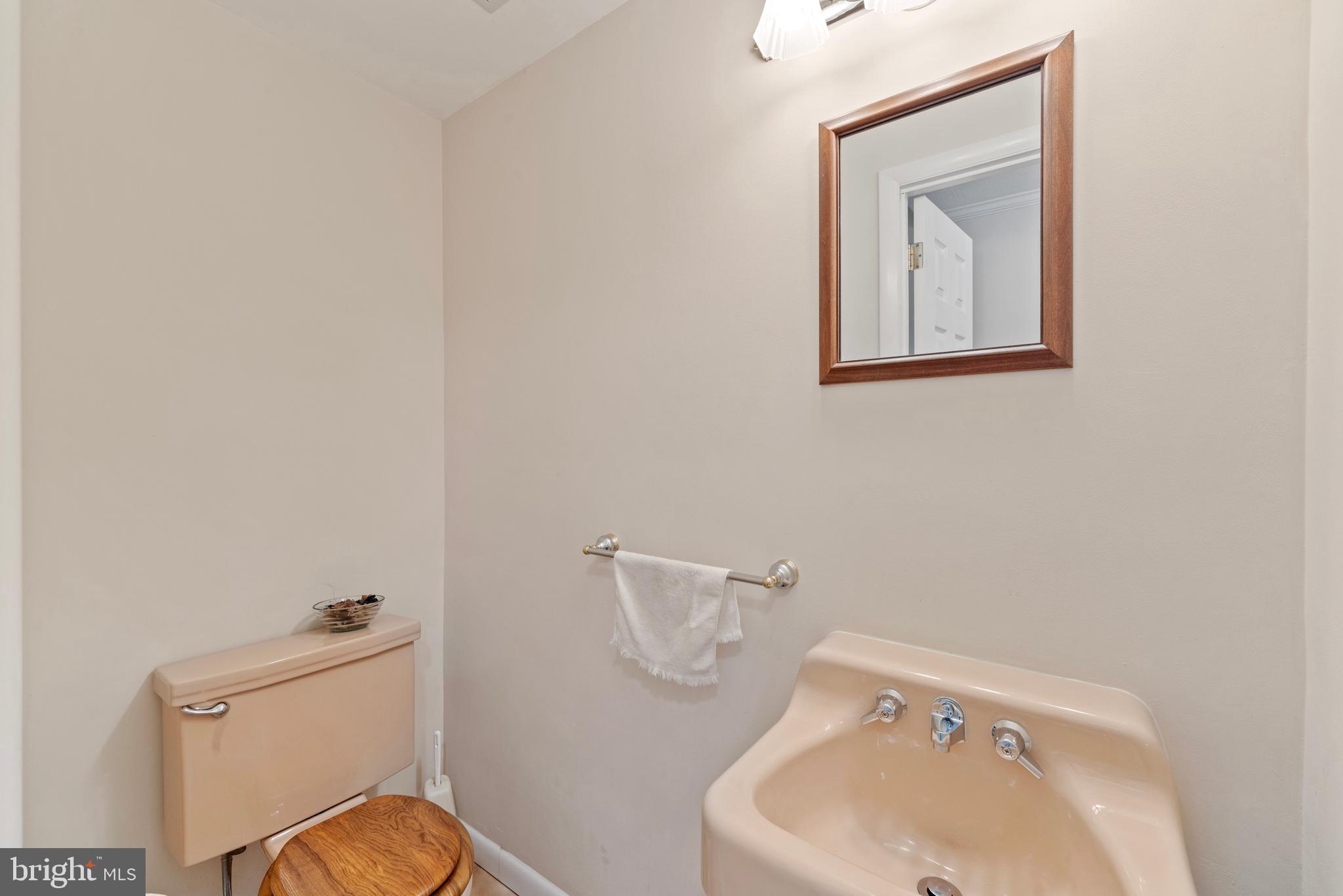 1131 Frederick Road Jenkintown, PA 19046 - Photo 26 of 30 a bathroom with a toilet sink and mirror