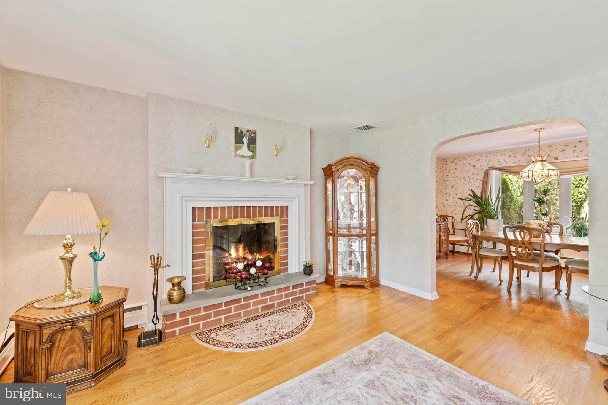 1131 Frederick Road Jenkintown, PA 19046 - Photo 6 of 30 a view of a livingroom with furniture a fireplace and large windows