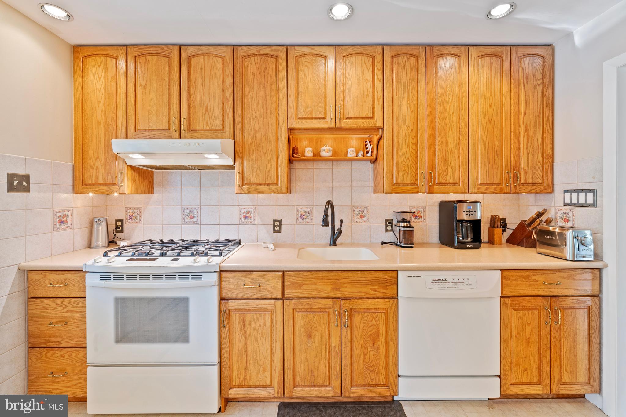 1131 Frederick Road Jenkintown, PA 19046 - Photo 10 of 30 a kitchen with a stove a sink and cabinets