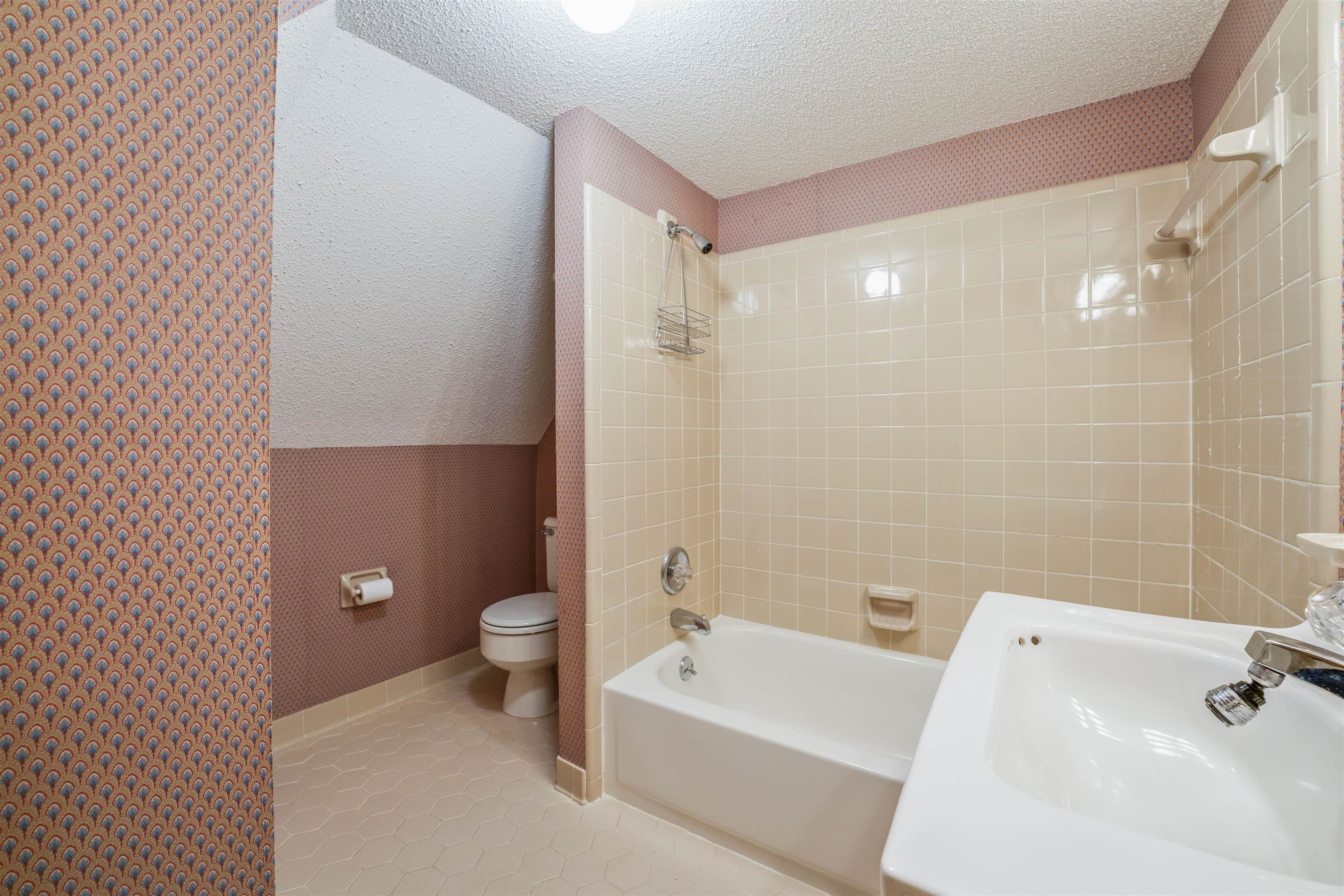 8497 Bazemore Road Memphis, TN 38018 - Photo 13 of 16 a bathroom with a bathtub shower sink mirror and toilet