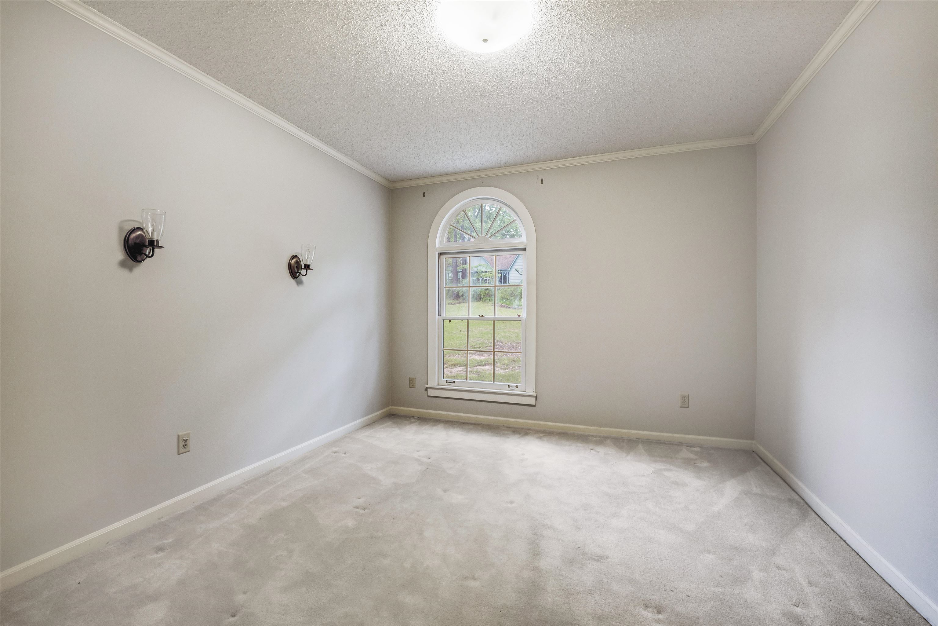 8497 Bazemore Road Memphis, TN 38018 - Photo 3 of 16 an empty room with a window
