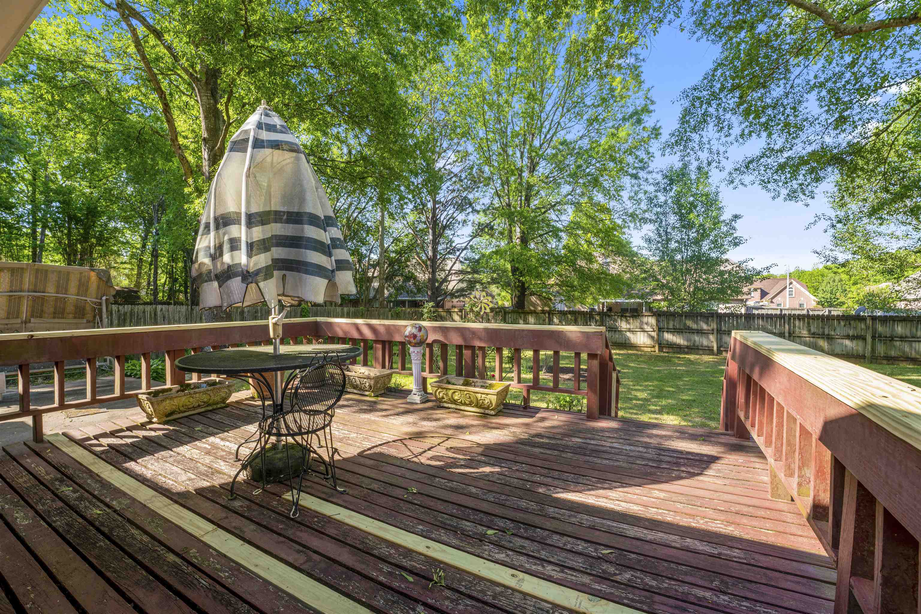 8497 Bazemore Road Memphis, TN 38018 - Photo 9 of 16 a view of a balcony with two chairs and a table