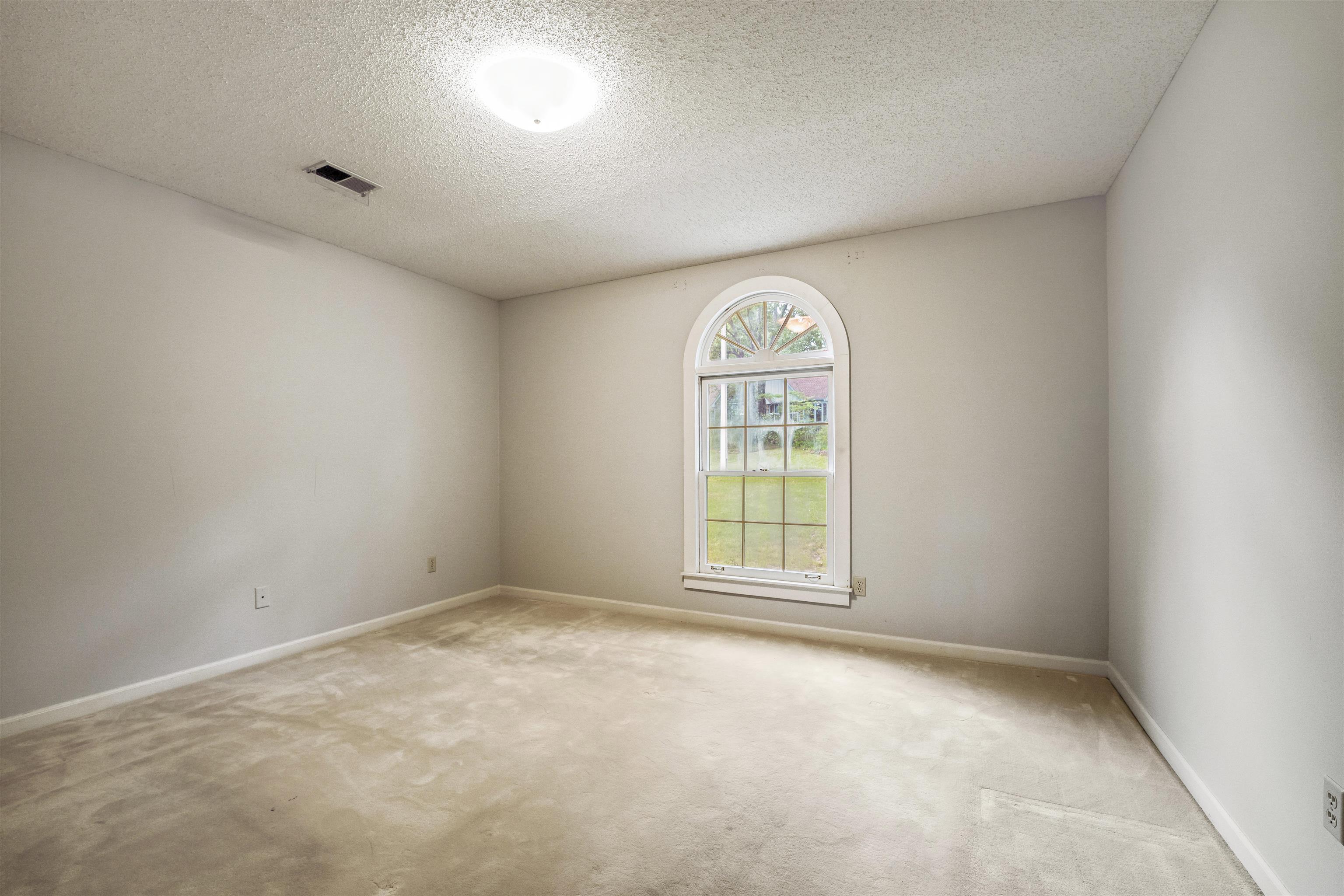 8497 Bazemore Road Memphis, TN 38018 - Photo 10 of 16 an empty room with a window
