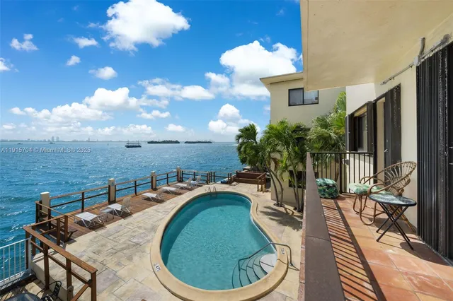 a view of a chairs and table in the patio