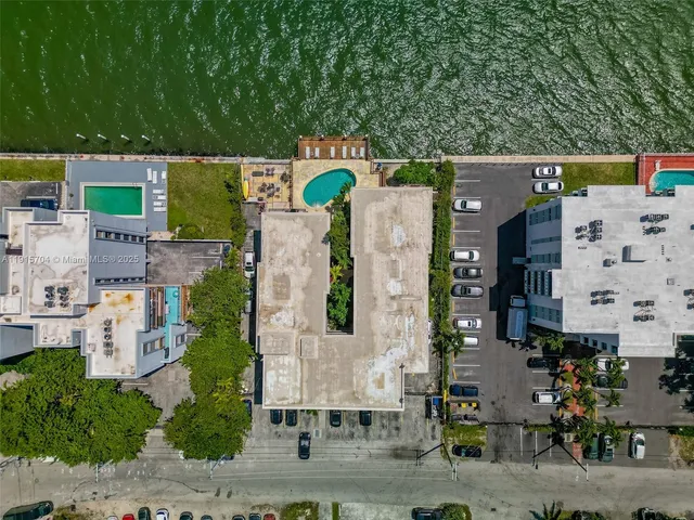 an aerial view of residential house with outdoor space and parking