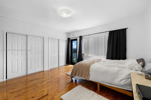 a bedroom with a bed and a closet