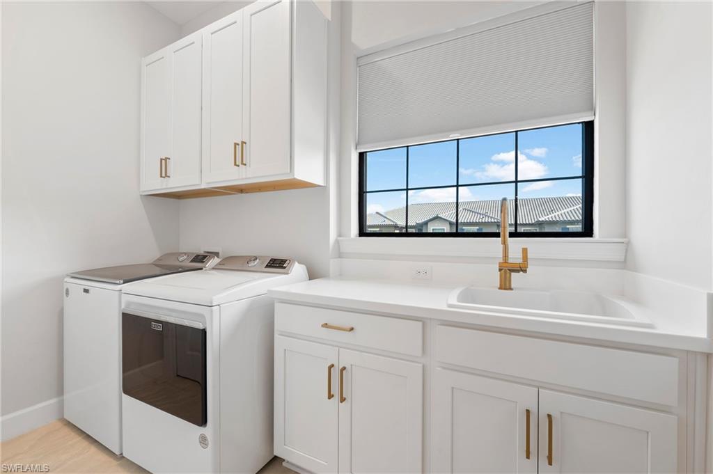 15328 Lucerna Street, Unit 202 Naples, FL 34114 - Photo 19 of 32 a view with cabinets a sink and a window