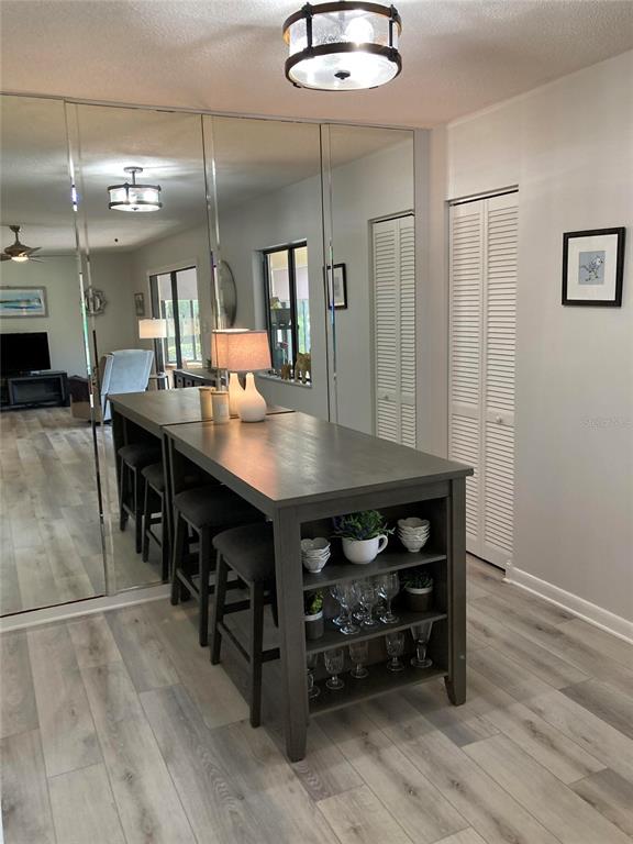 646 Midway Drive, Unit A Ocala, FL 34472 - Photo 4 of 15 a kitchen with stainless steel appliances cabinets and wooden floor