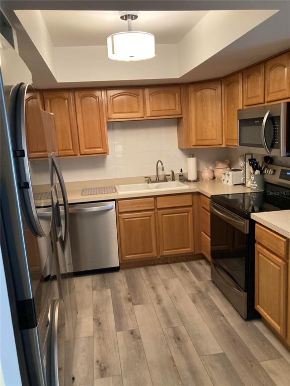 646 Midway Drive, Unit A Ocala, FL 34472 - Photo 6 of 15 a kitchen with stainless steel appliances granite countertop a sink stove and refrigerator