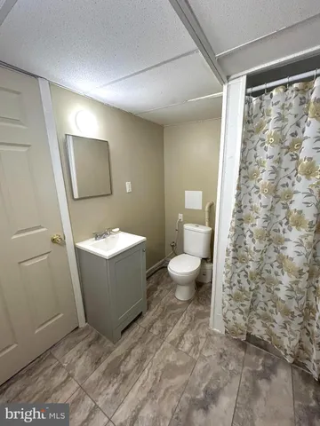 a bathroom with a toilet and a sink