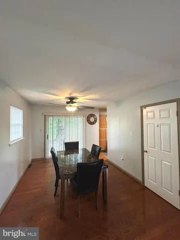 a view of a dining room with furniture and window