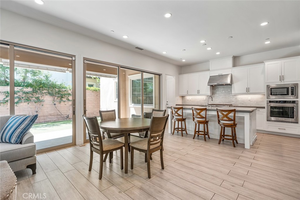 77 English Saddle Irvine, CA 92602 - Photo 11 of 35 a view of a dining room with furniture and wooden floor