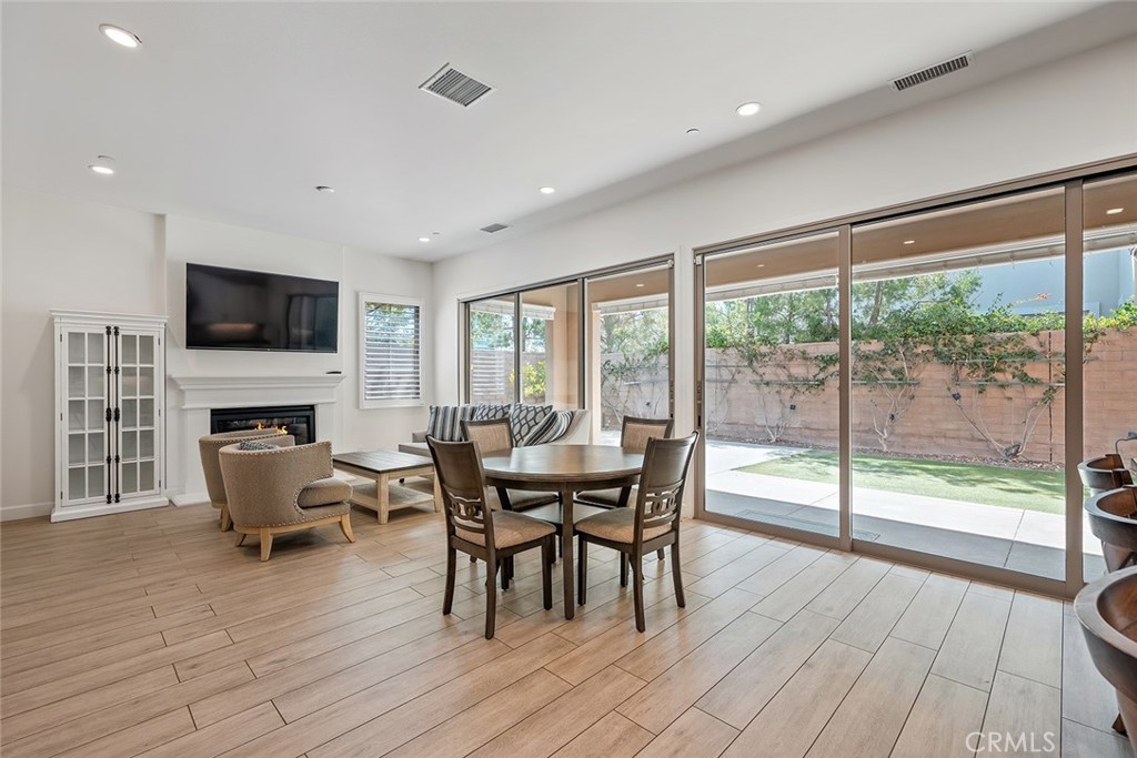 77 English Saddle Irvine, CA 92602 - Photo 16 of 35 a view of a dining room with furniture window and wooden floor