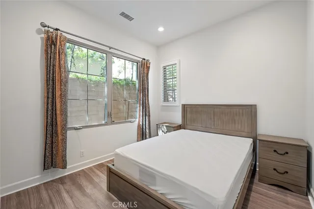 a bathroom with a shower sink vanity mirror and toilet
