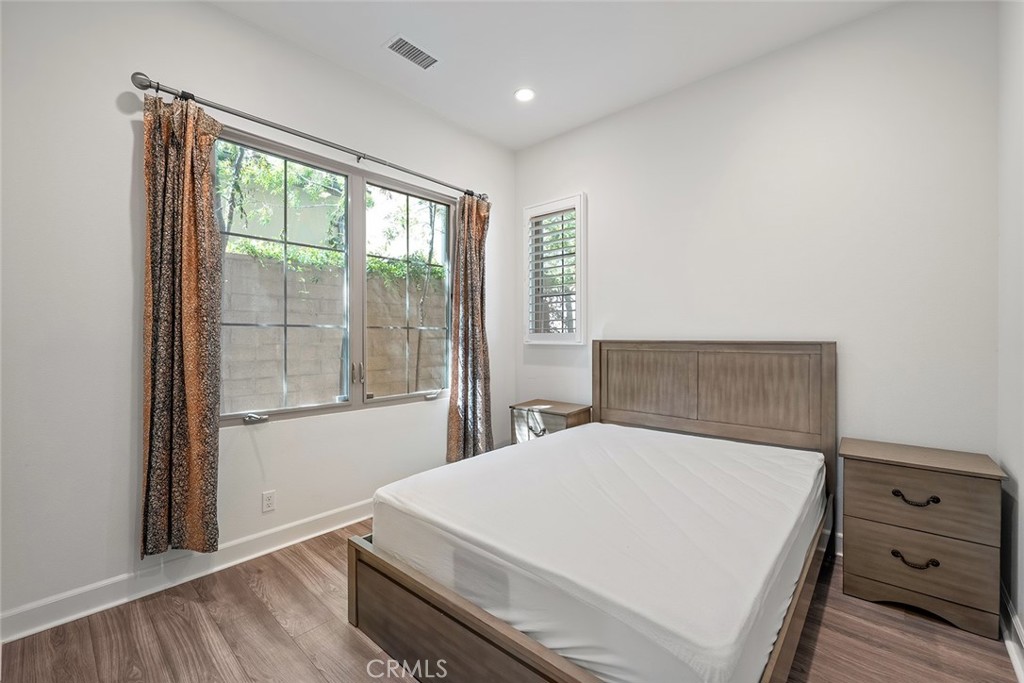 77 English Saddle Irvine, CA 92602 - Photo 17 of 35 a large bed sitting in a bedroom next to a window