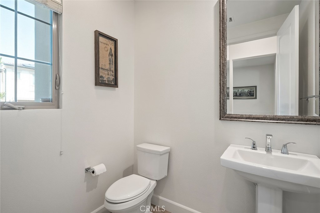77 English Saddle Irvine, CA 92602 - Photo 20 of 35 a bathroom with a toilet sink and mirror