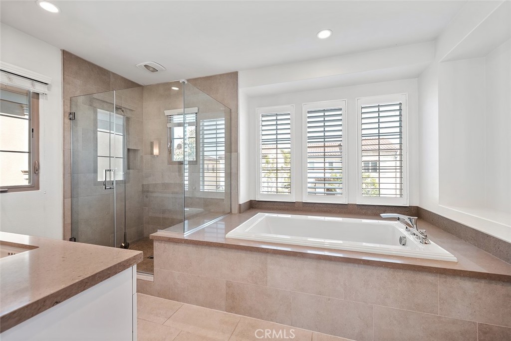 77 English Saddle Irvine, CA 92602 - Photo 25 of 35 a spacious bathroom with sink shower and bathtub