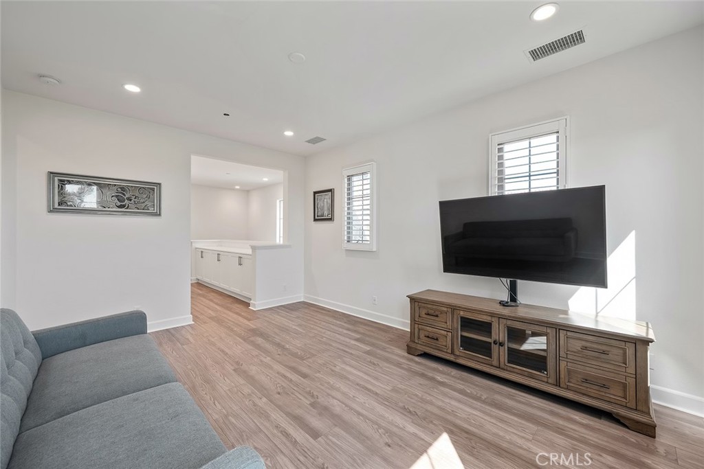 77 English Saddle Irvine, CA 92602 - Photo 28 of 35 a living room with furniture and a flat screen tv