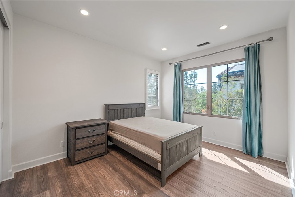 77 English Saddle Irvine, CA 92602 - Photo 29 of 35 a bed sitting in a spacious bedroom next to a window