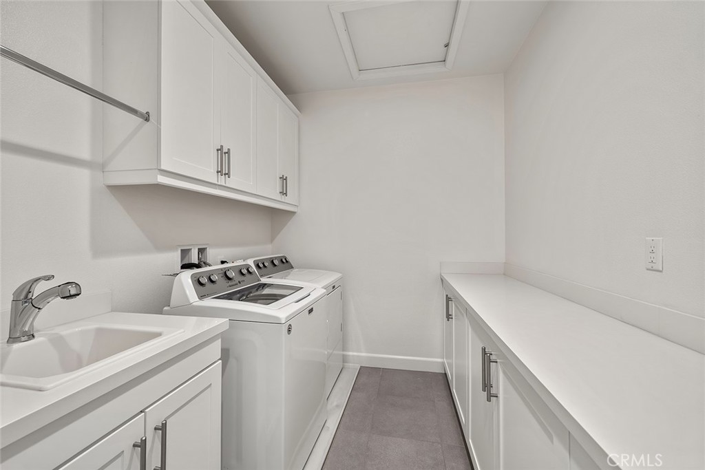 77 English Saddle Irvine, CA 92602 - Photo 35 of 35 a kitchen with a sink stove and cabinets