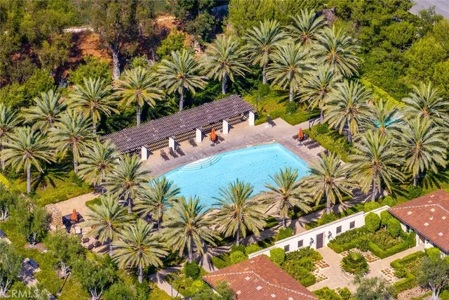 a living room with furniture a fireplace and a floor to ceiling window