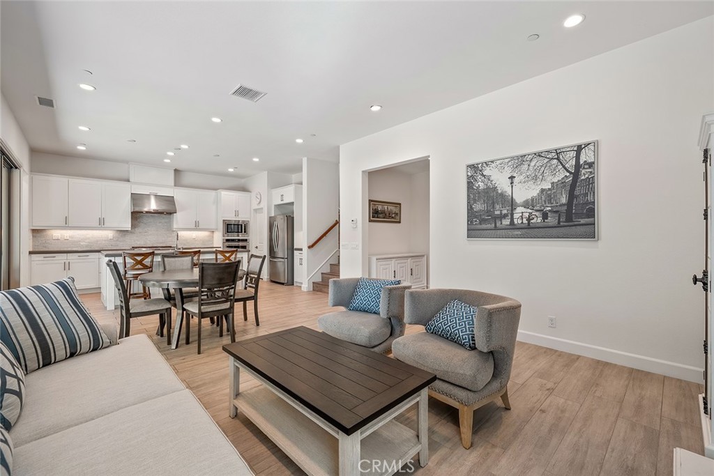 77 English Saddle Irvine, CA 92602 - Photo 10 of 35 a living room with furniture and kitchen view