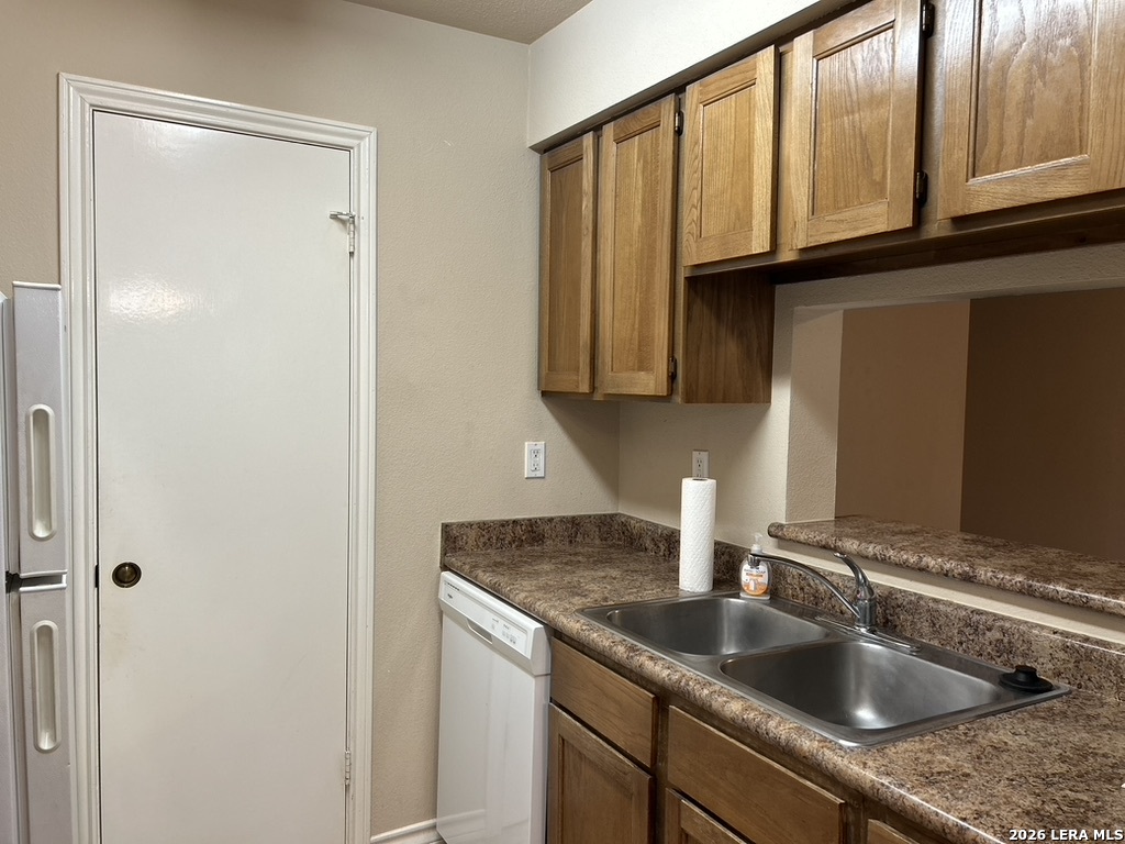 13018 Heimer Road, Unit 710 San Antonio, TX 78216 - Photo 11 of 27 a kitchen with stainless steel appliances granite countertop a sink and cabinets