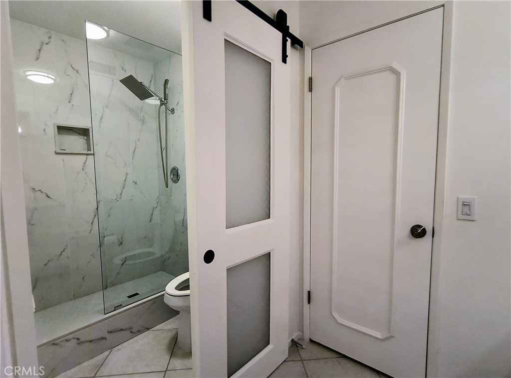 6 Whittier Court Rancho Mirage, CA 92270 - Photo 33 of 74 a bathroom with a shower and a glass door