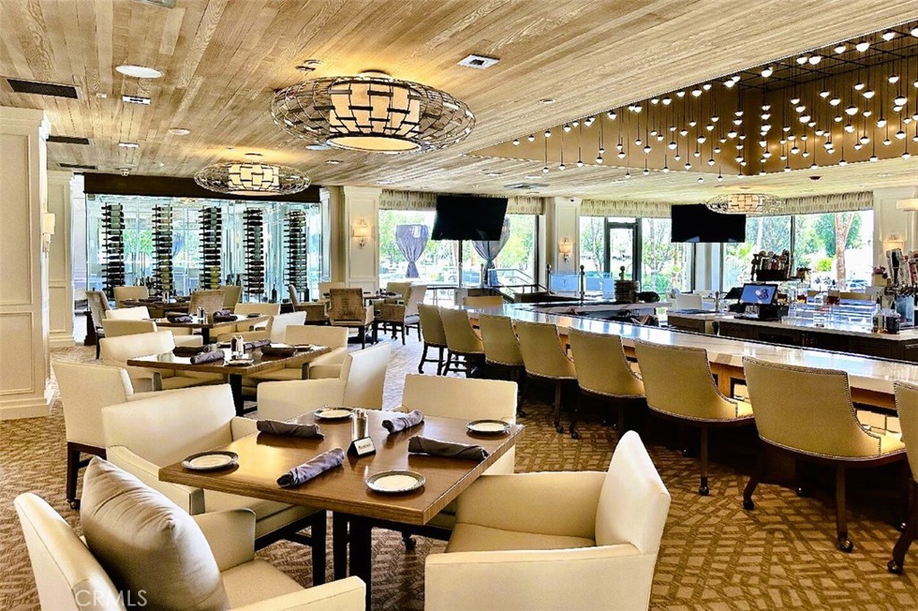 6 Whittier Court Rancho Mirage, CA 92270 - Photo 69 of 74 a living room with lots of furniture and a large window