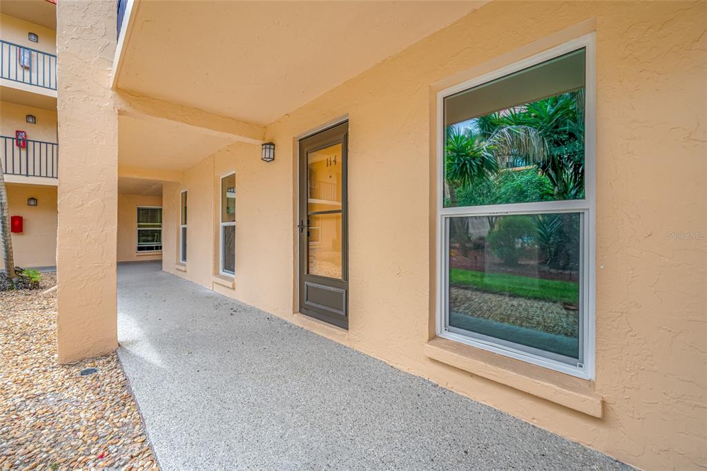 8911 Blind Pass Road, Unit 114 St. Pete Beach, FL 33706 - Photo 14 of 43 a view of livingroom with furniture