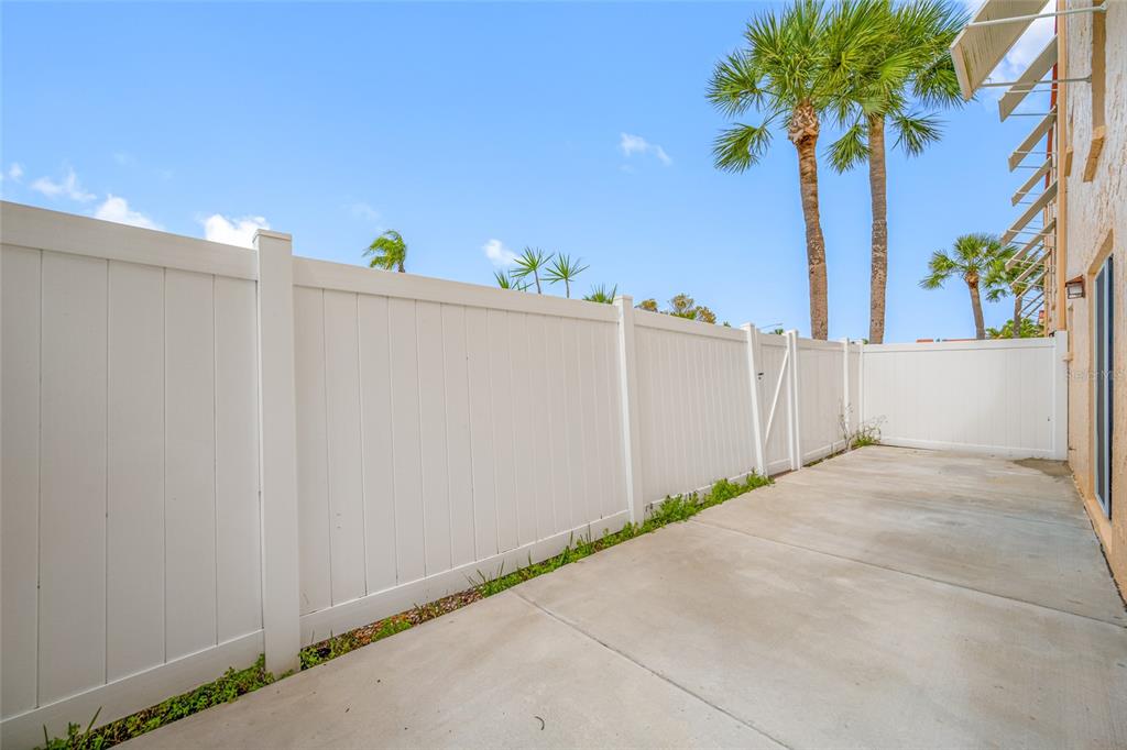 8911 Blind Pass Road, Unit 114 St. Pete Beach, FL 33706 - Photo 33 of 43 a view of a room with potted plants