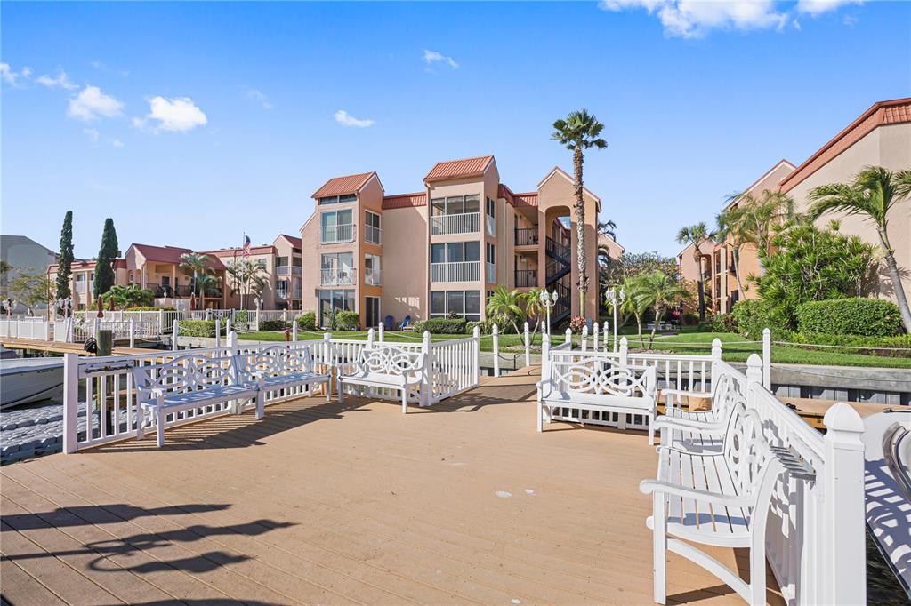 8911 Blind Pass Road, Unit 114 St. Pete Beach, FL 33706 - Photo 38 of 43 a view of a terrace with sitting area