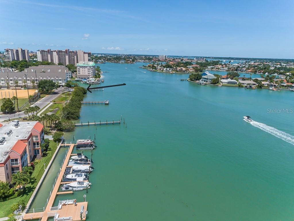 8911 Blind Pass Road, Unit 114 St. Pete Beach, FL 33706 - Photo 41 of 43 a view of a city with an ocean view