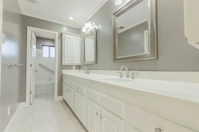 a bathroom with a double vanity sink mirror and a shower