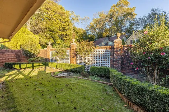 a view of a garden with a fountain