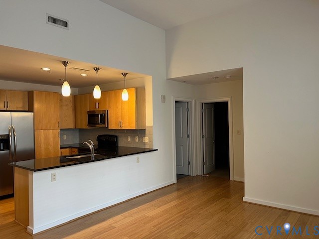 230 North 6th Street, Unit U512 Richmond, VA 23219 - Photo 5 of 15 a view of a kitchen with a sink and a refrigerator