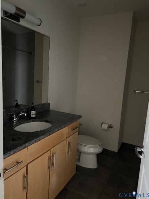 230 North 6th Street, Unit U512 Richmond, VA 23219 - Photo 8 of 15 a bathroom with a granite countertop toilet and a sink