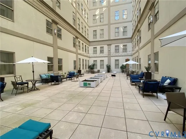 a lobby with furniture and a rug