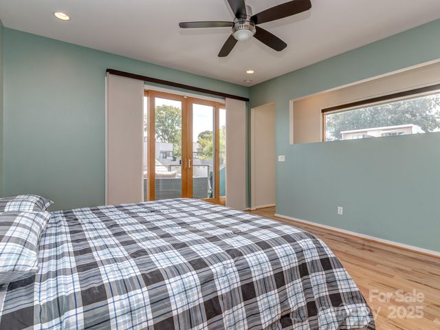 a bedroom with a large bed and a window