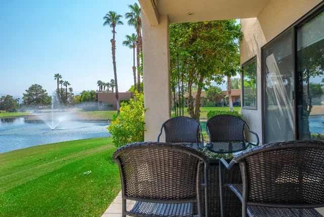 a couple of chairs sitting in backyard of house