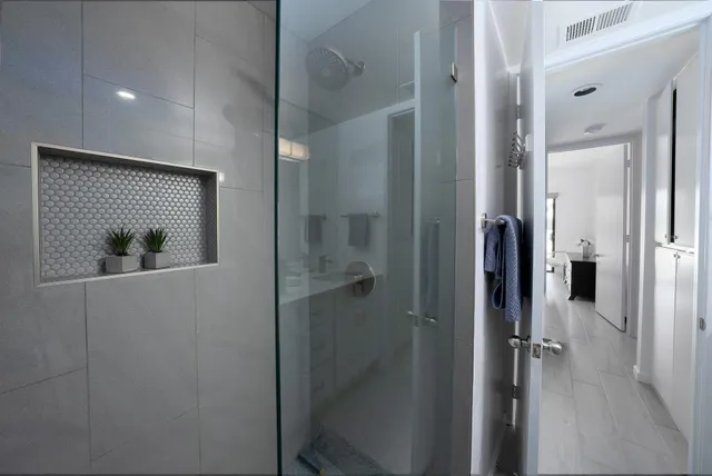 a view of a bathroom from a hallway