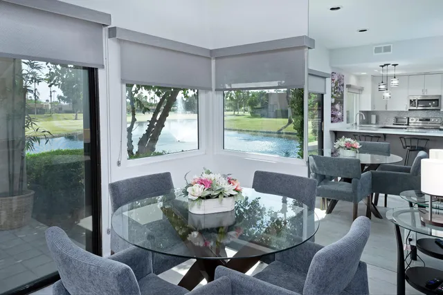 a view of a dining room with furniture window and outside view