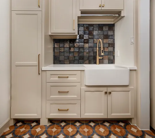 a view of wooden floor and windows in a room