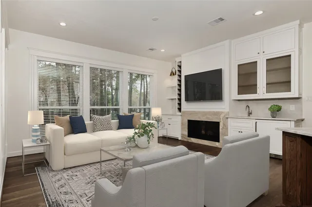 a spacious bathroom with a double vanity sink mirror and bathtub