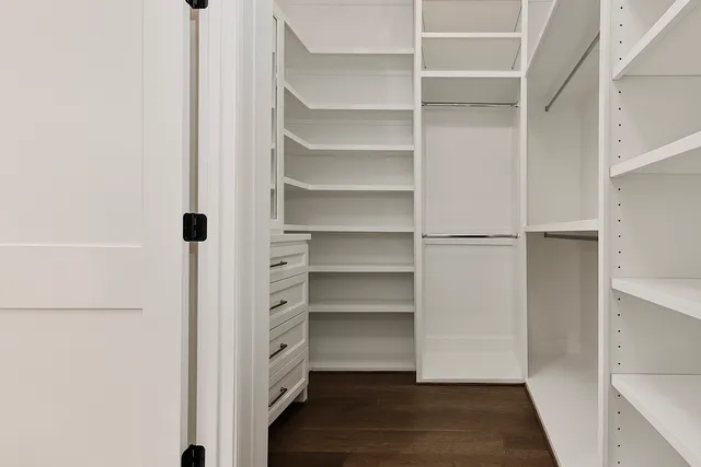 a bathroom with a black and white checkered floor