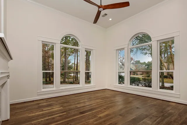 a work room with furniture and a large window