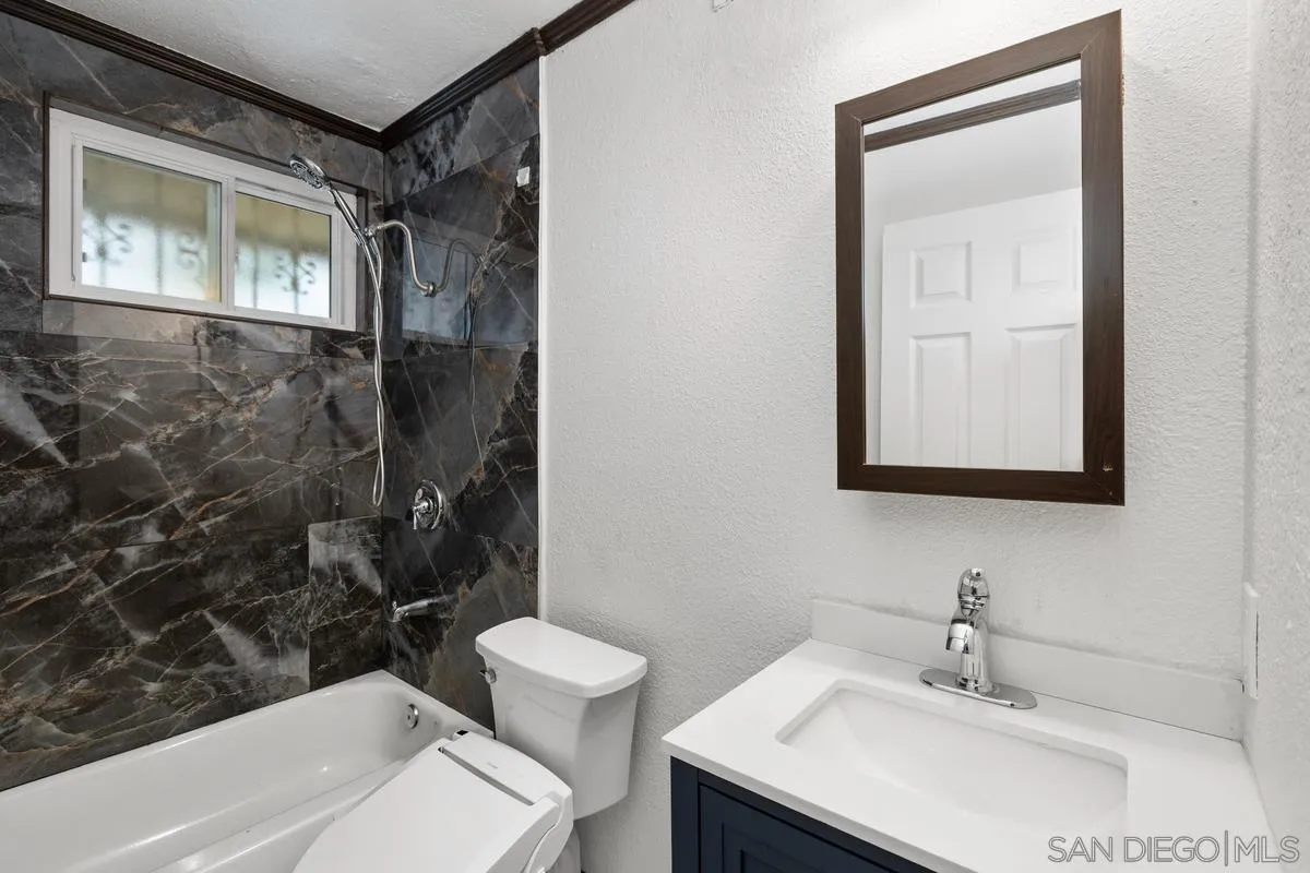348 Sychar Road San Diego, CA 92114 - Photo 17 of 30 a bathroom with a sink toilet and shower