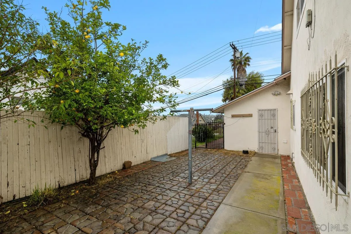 348 Sychar Road San Diego, CA 92114 - Photo 24 of 30 a backyard of a house with lots of green space