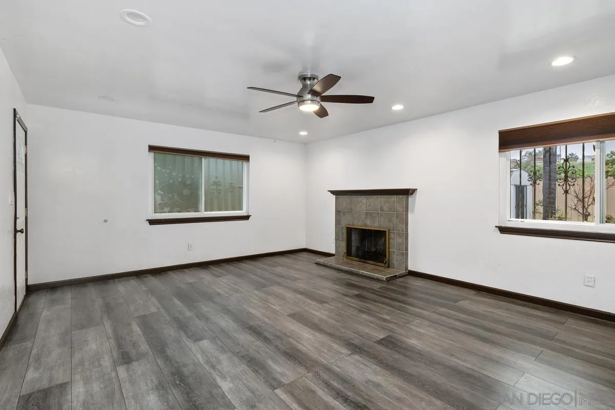 348 Sychar Road San Diego, CA 92114 - Photo 4 of 30 a view of an empty room with a window and fireplace
