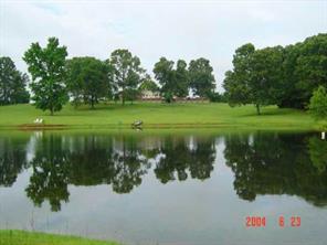 3361 Camp Creek Road Lancaster, SC 29720 - Photo 1 of 5 a view of a lake from a garden